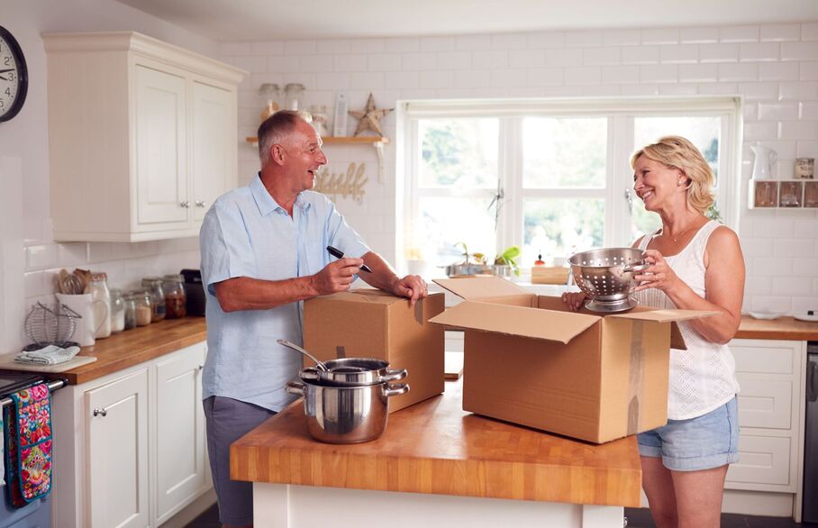 A couple packing-up kitchen