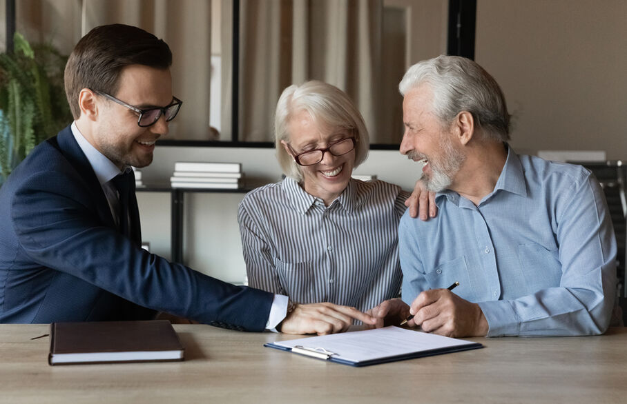 A couple having a meeting with an estate agent