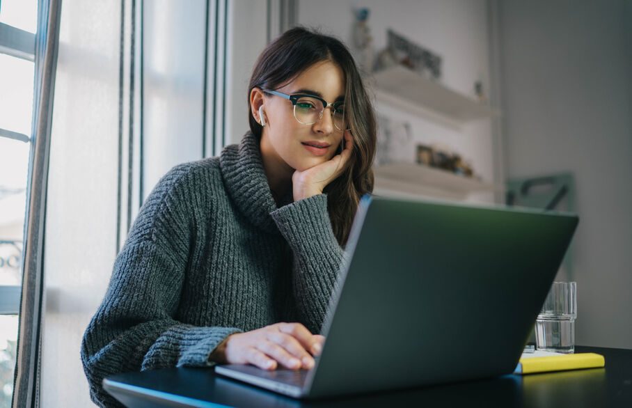 A person looking at their laptop