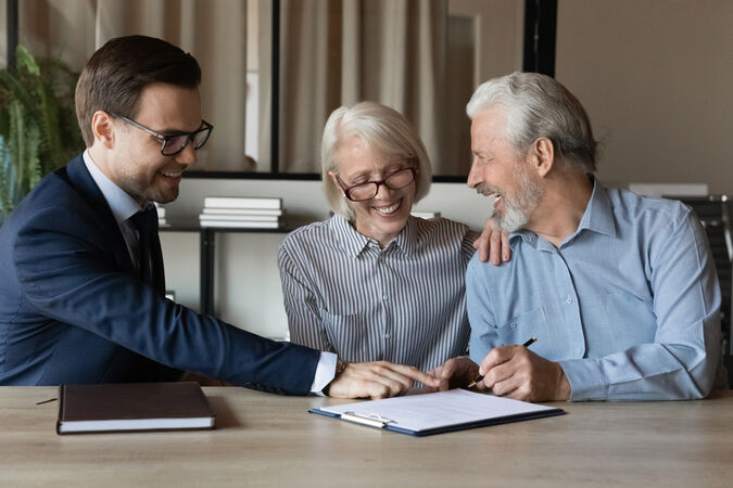 A couple having a meeting with an estate agent