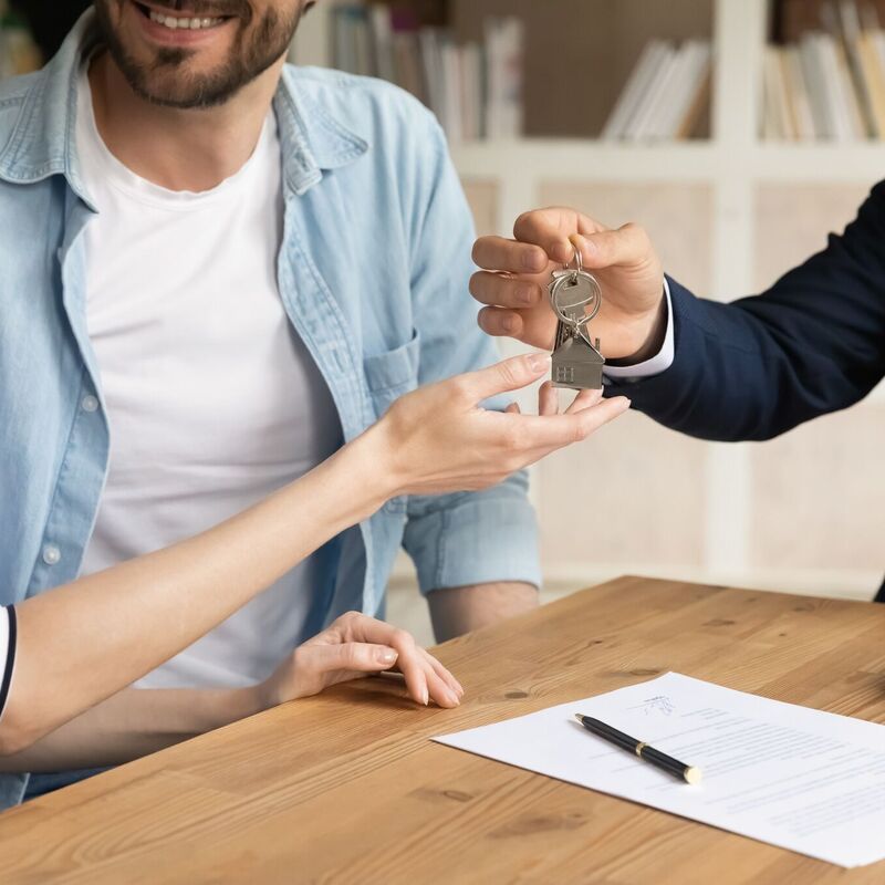 Couple getting keys to new property