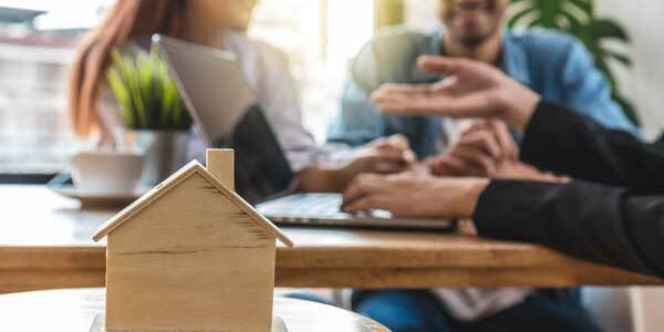 Happy tenants meeting with estate agent 