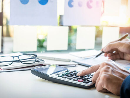 Businessman using a calculator