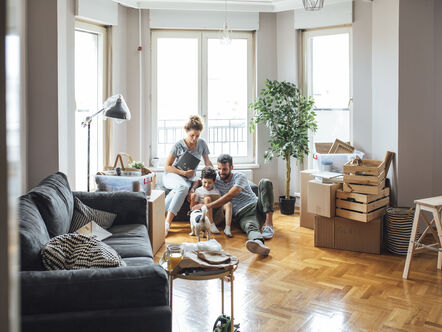 Husband and wife and their child moving in new home